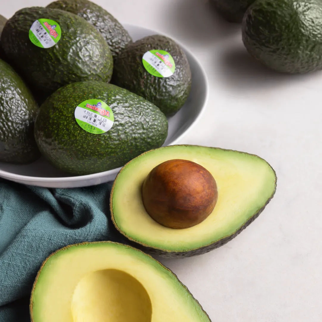 bowl of avocados and cut avocados