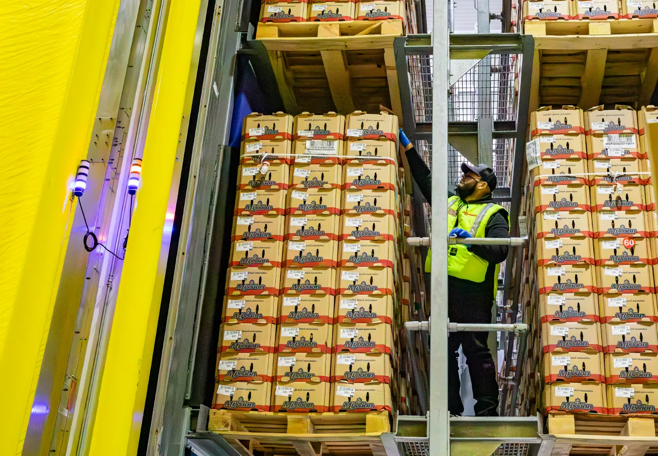 Mission Employee checking stacks of Mission avocado boxes