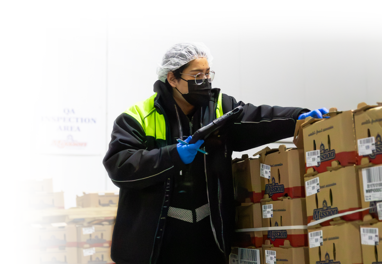 Mission worker inspecting product before shipping