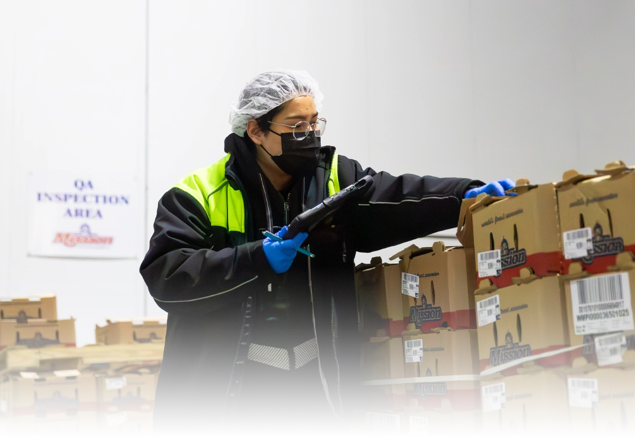 Mission worker inspecting product before shipping